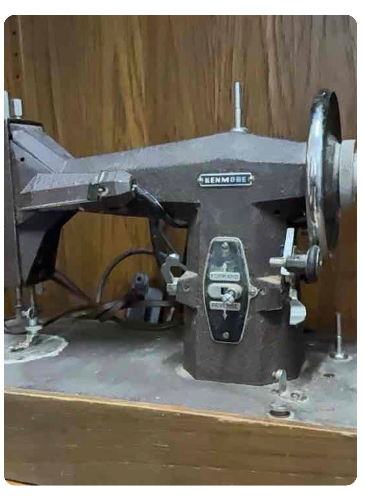 A Vintage Kenmore Sewing Machine with a Wooden Base
