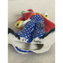 Load image into Gallery viewer, 1984 Ceramic Squinting Clown Red Coat Polka Dot Pants Ornament Signed "Paula"