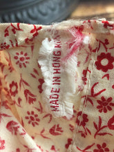 Load image into Gallery viewer, Vintage Drink and Wet 5-1/2" Baby Doll Rubber Head Molded Hair in a White and Red Floral Dress, Buddha Belly Baby Doll