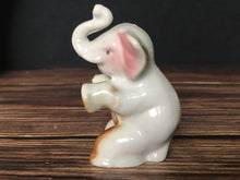 Load image into Gallery viewer, High Gloss Porcelain Elephant Sitting Trunk Up with Pink Ears Made in Japan