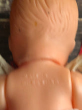 Load image into Gallery viewer, Vintage Drink and Wet 5-1/2" Baby Doll Rubber Head Molded Hair in a White and Red Floral Dress, Buddha Belly Baby Doll