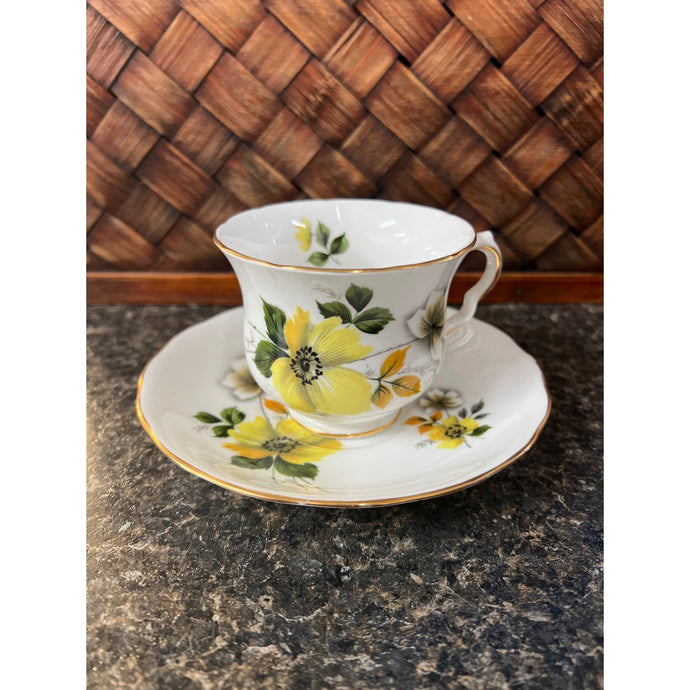Crown Royal bone China with yellow, white, gray flowers and forest green leaves Made in England