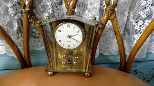 Vintage 8-Day Brass Anniversary Clock with Glass Panels and Rotating Pendulum