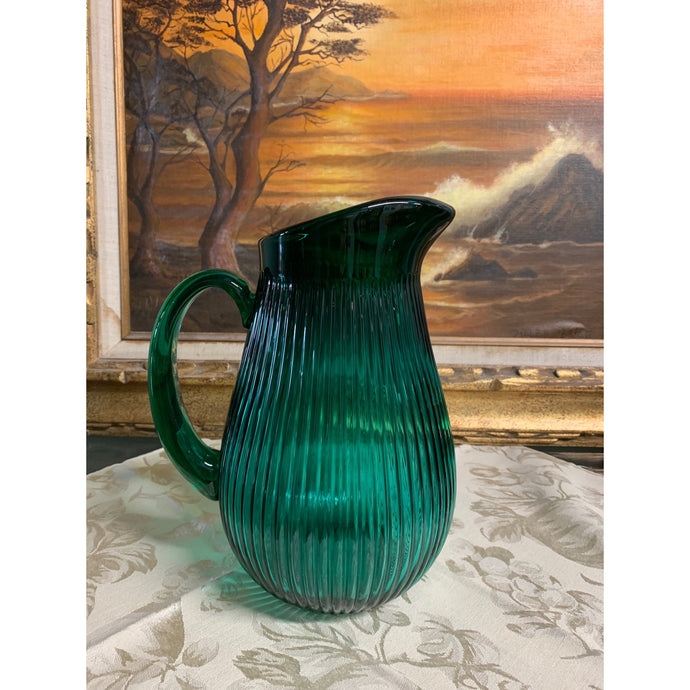 Emerald green glass pitcher