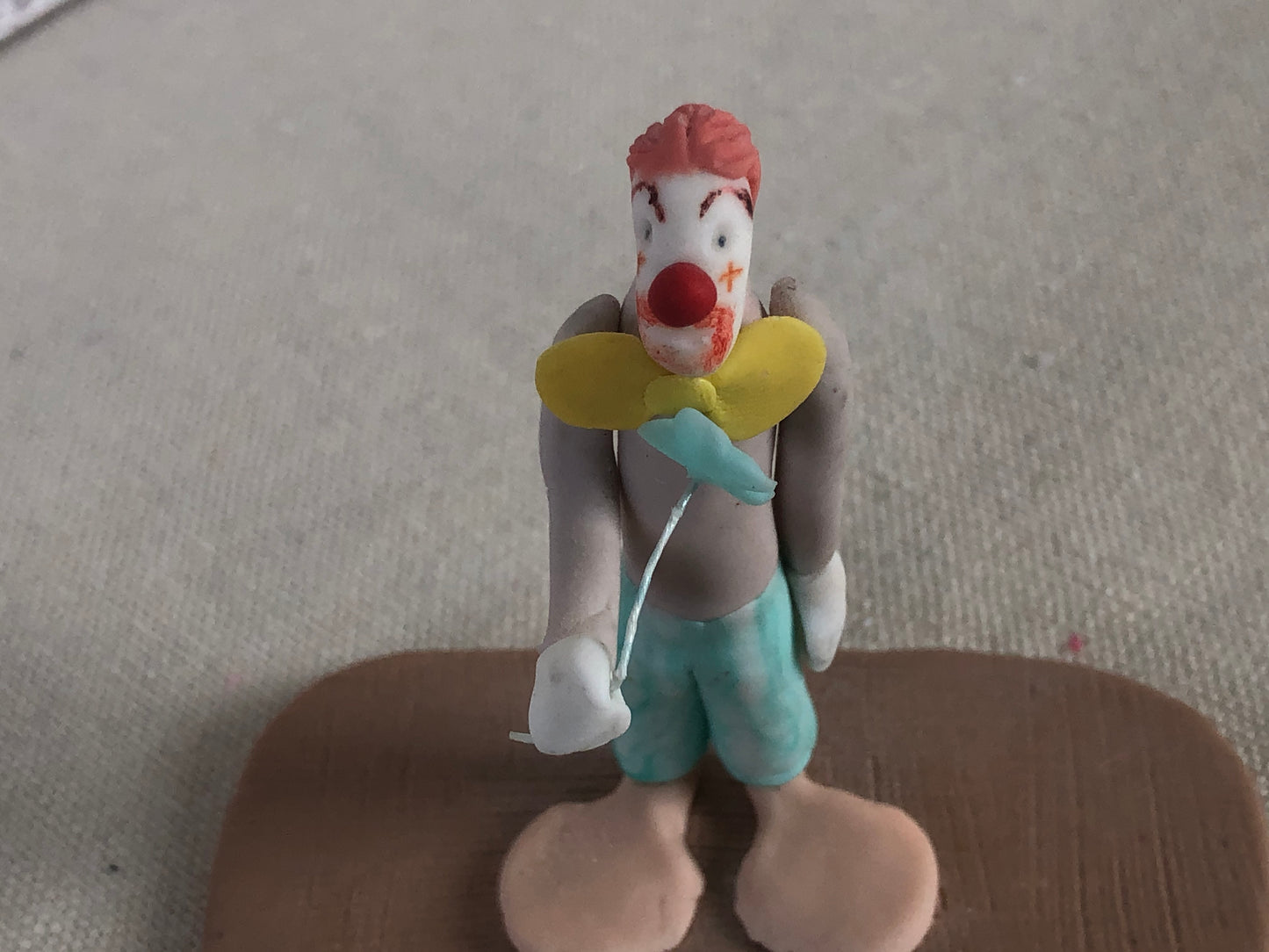 Folk Art Polymer Clay Clown Holding Flower Figurine Signed