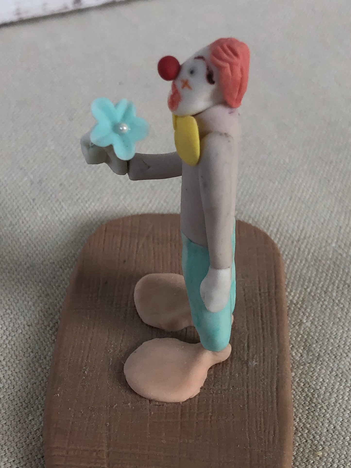 Folk Art Polymer Clay Clown Holding Flower Figurine Signed
