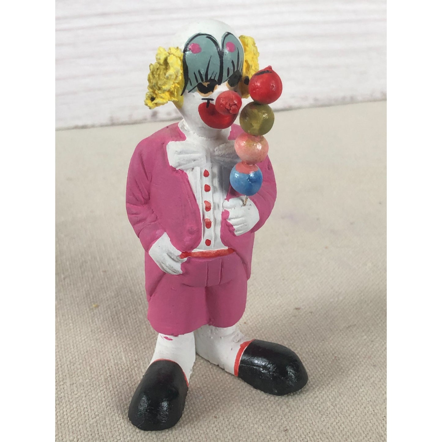 Vintage Mexican Folk Art Paper Mache Clown in Pink Holding Four Balls on a Stick