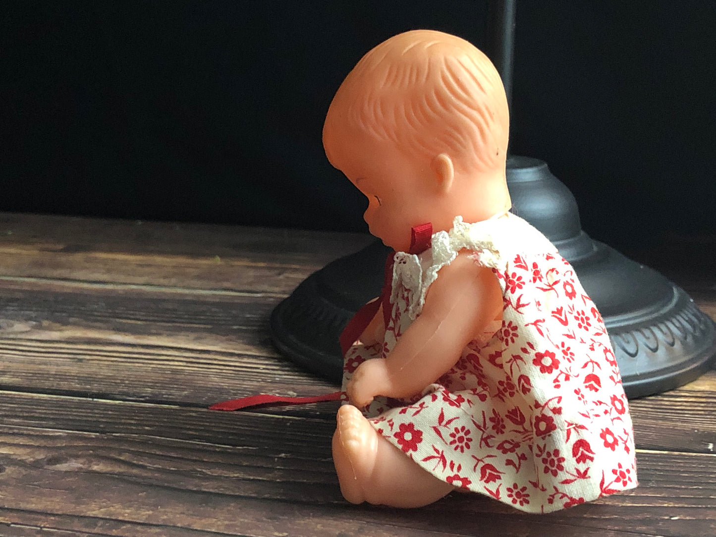 Vintage Drink and Wet 5-1/2" Baby Doll Rubber Head Molded Hair in a White and Red Floral Dress, Buddha Belly Baby Doll