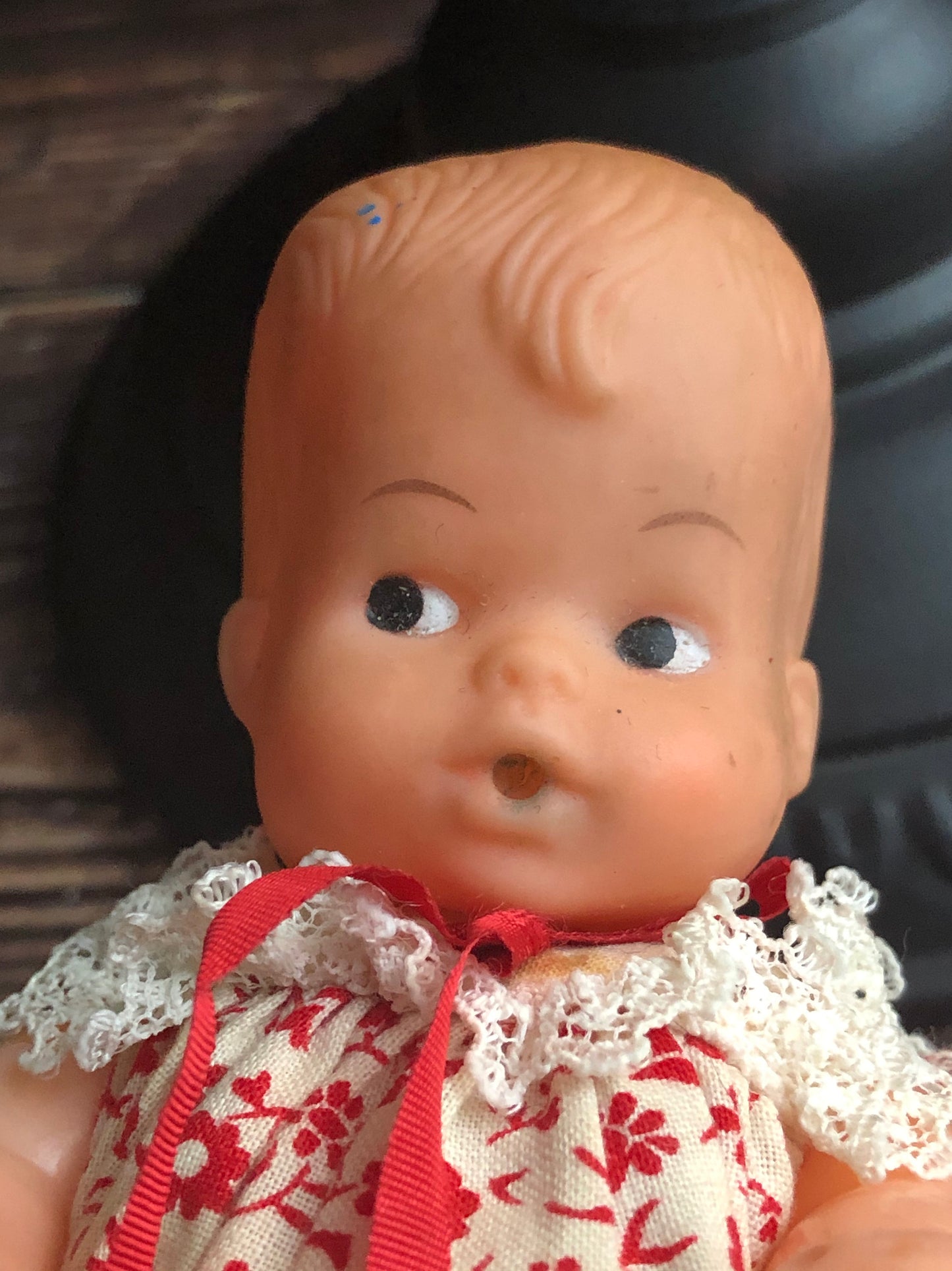 Vintage Drink and Wet 5-1/2" Baby Doll Rubber Head Molded Hair in a White and Red Floral Dress, Buddha Belly Baby Doll
