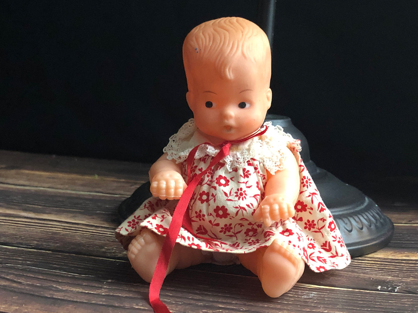 Vintage Drink and Wet 5-1/2" Baby Doll Rubber Head Molded Hair in a White and Red Floral Dress, Buddha Belly Baby Doll